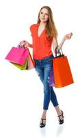 Happy lovely woman with shopping bags over white photo