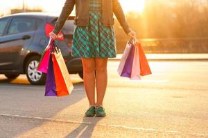 Woman holding her shopping bags in her hand photo