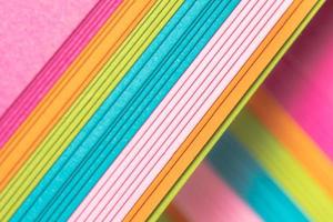 A stack of bright paper for artistic projects. photo