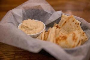 Hummus and pita bread photo