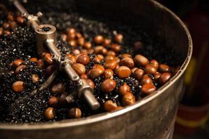 Roasting Chestnuts on hot coal photo