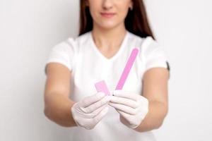 Manicure tools in hands of manicurist photo