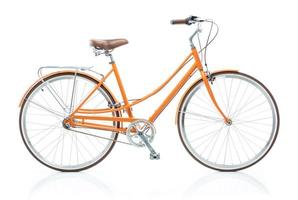 Stylish orange bicycle isolated on white background photo