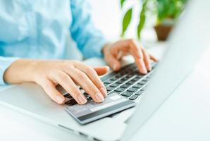 Woman office worker typing on the keyboard photo