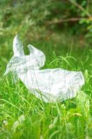 Plastic bags lying on grass photo
