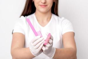 Manicure tools in hands of manicurist photo