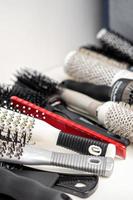 Different hair brushes and combs photo