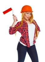 Funny girl in a helmet with roller in hand it is isolated on the white photo