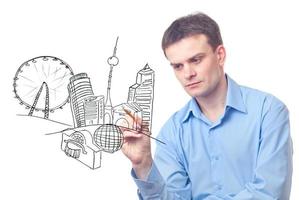 Businessman drawing a city of the future photo