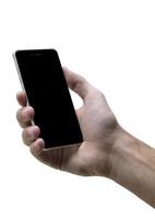 Male hand holding black cellphone with black screen at isolated white background. photo