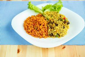 Delicious dish made of two kinds of rice on a white plate photo