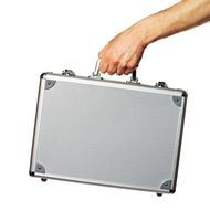 Silver metal briefcase in hand photo