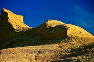 Ghost City in Xinjiang, China is a typical Yardang landform. photo