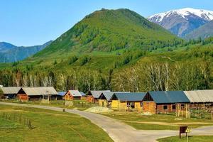 Hemu Village in Xinjiang is like a fairyland, the traditional and simple wooden houses are peaceful and isolated from the world photo