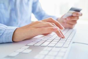 Male hands typing on the keyboard photo