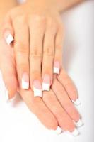 Beautiful female hands with french manicure photo