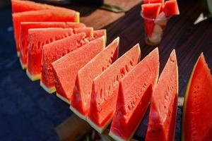 Watermelon vendors at a market in Urumqi, Xinjiang, China photo