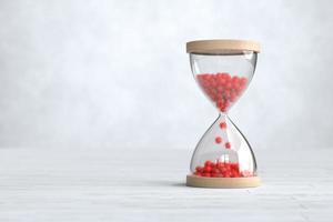 Hourglass with COVID-19, Coronavirus outbreak time count down concept. photo