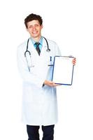 Smiling male doctor showing clipboard with copy space for text photo