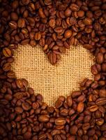 Heart shape created with coffee beans photo