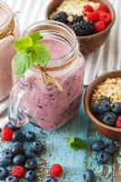 Well being and weight loss concept, berry smoothie and oatmeal with ingredients photo