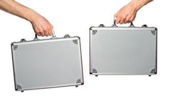 Silver metal briefcase in hands photo