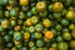 Green Yellow Raw Ripe Orange  can be used as a  textured background photo