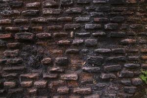 Old historical building brick wall grunge pattern texture can be used as a background wallpaper photo