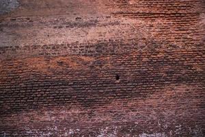 Old historical building brick wall grunge pattern texture can be used as a background wallpaper photo