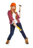 Young woman worker in helmet with the work tools on a white photo