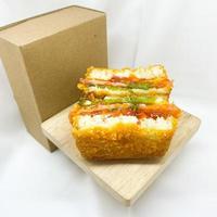 Delicious Fried Sandwich on Mini Table. photo