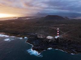 Lighthouse Faro de Rasca on The Tenerife, Canary Islands, Spain. Wild Coast of the Atlantic Ocean photo