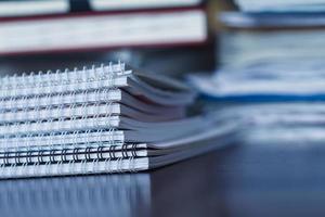 Large pile of magazine, notebook and books closeup photo