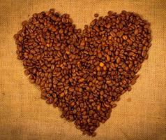 Heart shape created with coffee beans photo
