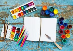 Art painting materials on wooden background photo