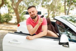 Man traveling in a car photo