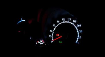 Speedometer illuminated at night photo