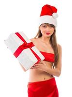 Beautiful Santa christmas girl with gift isolated on white photo