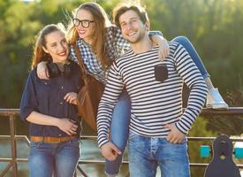 Smiling friends having fun outdoors photo