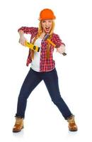 Young woman worker in helmet with the work tools on a white photo