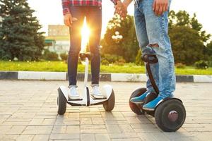 Young couple riding hoverboard photo