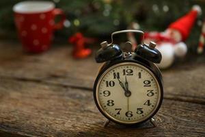 Vintage clock on christmas background photo