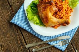 Tasty dish of chicken thigh with rice photo