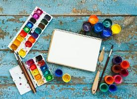 Art painting materials on wooden background photo