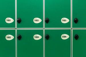 Green doors with numbers and locks photo