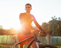 The guy with the bike in the early morning photo