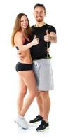 Athletic man and woman after fitness exercise with thumbs up on the white photo