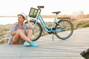 Young woman with bicycle photo