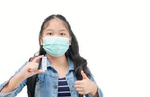 cute traveler wear mask shows rapid Coronavirus Covid-19 negative test device with negative test result photo