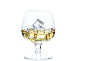 whiskey or brandy with ice in Snifter or Balloon glass isolated on white background, photo